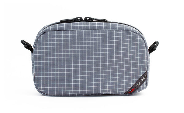 An all-fabric Northwest Sky grey with white grid pattern 3D Organizer Cube.